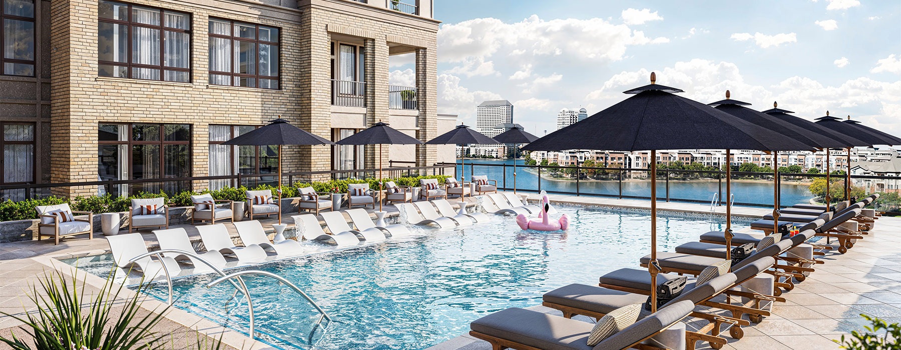 Close up view of pool umbrella covered lounge chairs